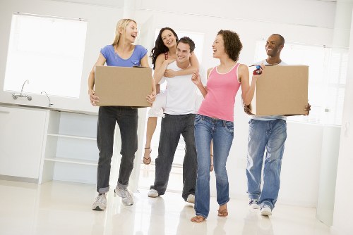Removal van and moving crew near residential streets in Hackney