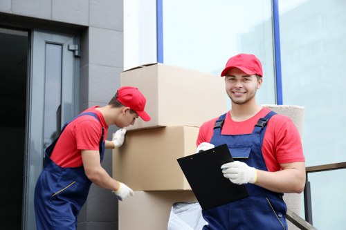 Moving boxes and furniture during a home move in Hackney