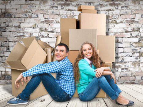 Van moving service with items being loaded for a booking