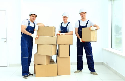 Unpacking and organising boxes in a Hackney flat after moving