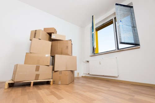 Professional movers transporting furniture in Hackney