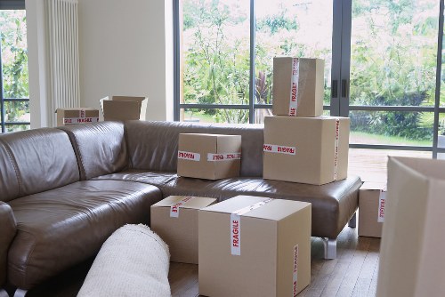 Moving van outside a Hackney flat building with packed belongings